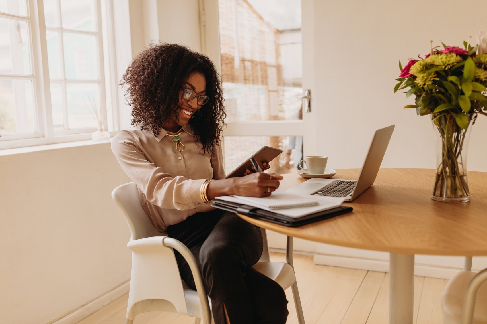 Woman Entrepreneur Working from Home on Laptop